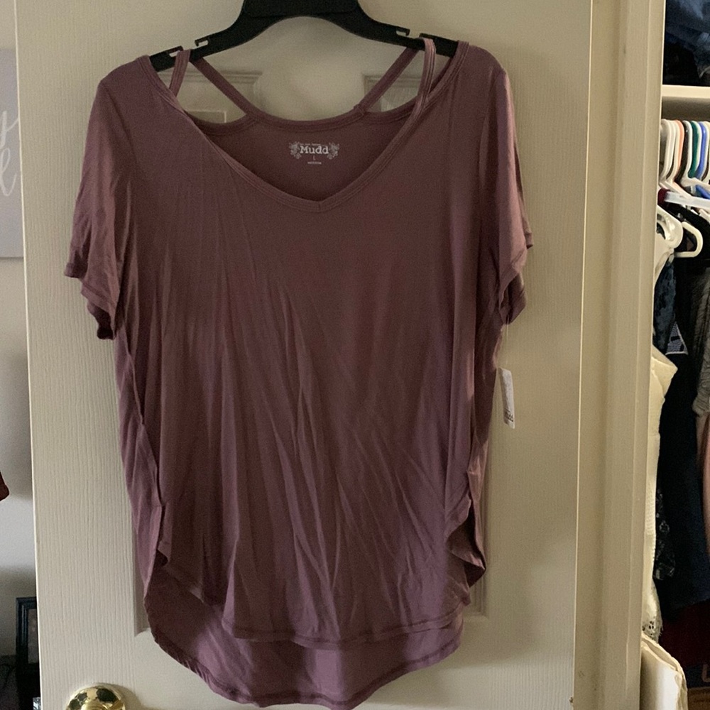 Purple T-shirt that needs ironing as it has been sitting in a closet. Size Large